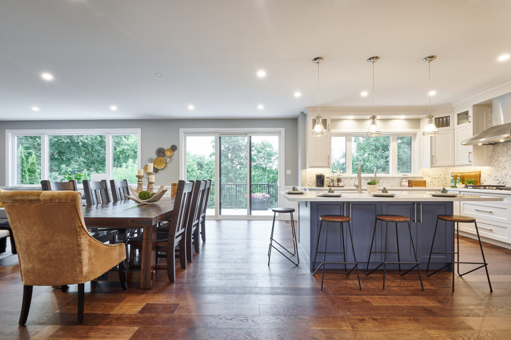 A large open kitchen with a dining table and chairs.